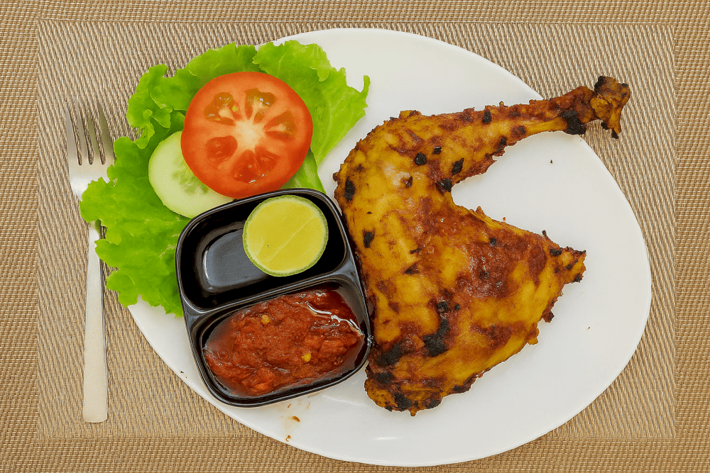 Discover the delicious variety of Indonesian cuisine at Batavia, from savory grilled chicken to flavorful side dishes